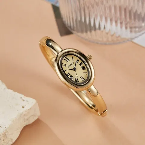 Relógio Elegante Oval NAIDU para Mulheres com Mostrador de Números Romanos, Pulseira Dourada Prateada, Relógio de Pulso à Prova d'Água com Movimento de Quartzo